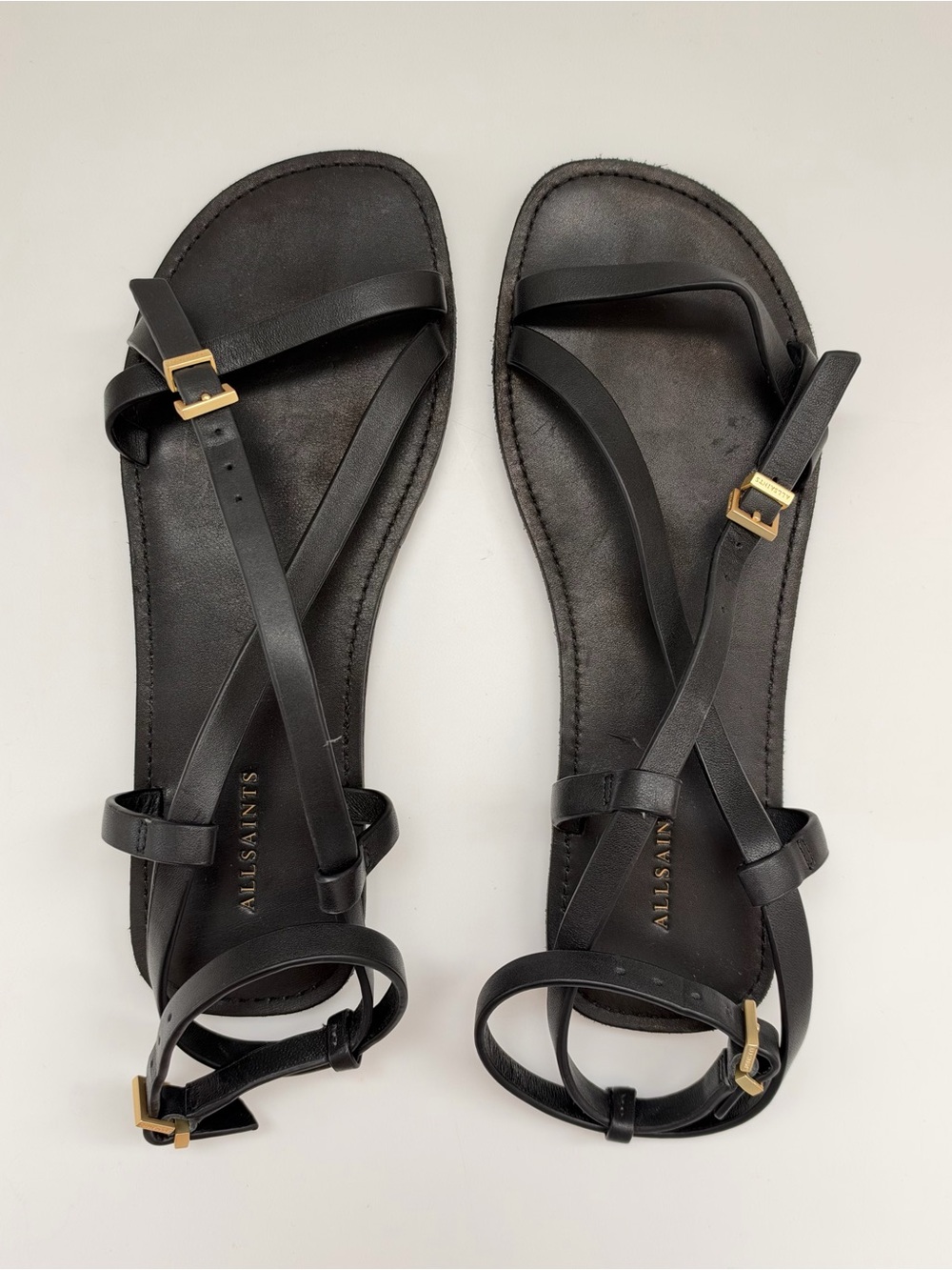 All Saints Black Leather Cross-Strap Sandals with Gold Buckles